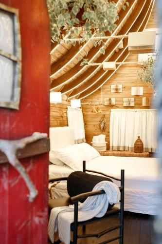 Ein Bett oder Betten in einem Zimmer der Unterkunft Cabana Alecrim com Spa Privativo CAMBORIÚ SC