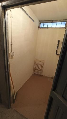 an empty room with a door and a window at Casa Stella Baita Valle Viva in Roure Turin