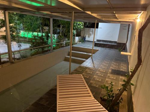 a room with a bench on the side of a building at Sir Mam Ashram in Bhaddi