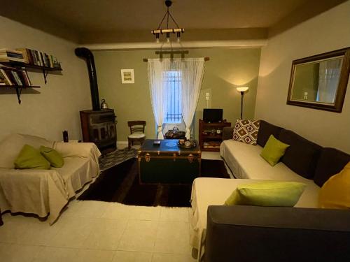 a living room with a couch and a table at Forrest Guesthouse in Polídhroson