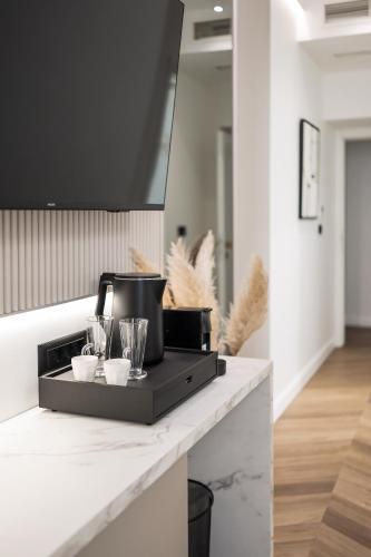 a coffee maker on a counter in a kitchen at De Pusterla Luxury Rooms in Zadar