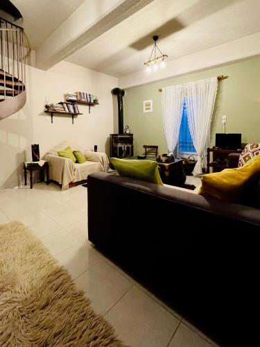 a large living room with a couch and a living room at Forrest Guesthouse in Polídhroson