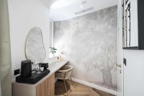 a bathroom with a sink and a mirror at De Pusterla Luxury Rooms in Zadar