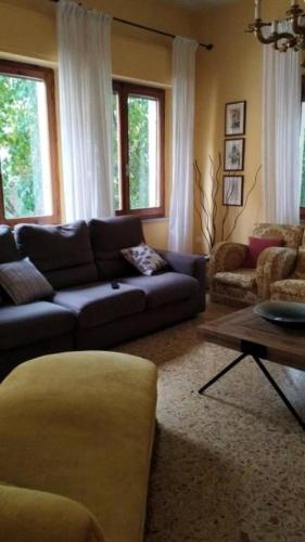 a living room with a couch and a table at La Dimora Di Anna in Chiusi