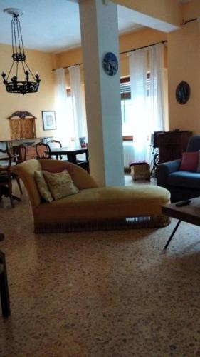 a living room with a couch and a table at La Dimora Di Anna in Chiusi