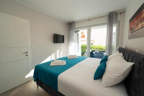 Postel nebo postele na pokoji v ubytování Relax Apartments