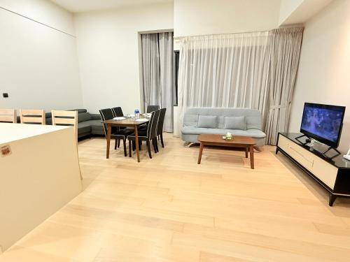 a living room with a couch and a table at Star Residence KL in Kuala Lumpur