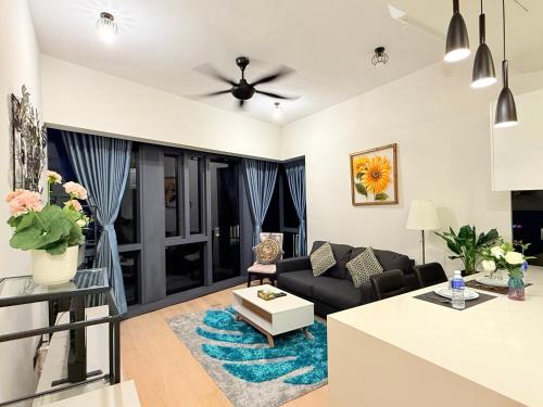 a living room with a couch and a table at Star Residence KL in Kuala Lumpur