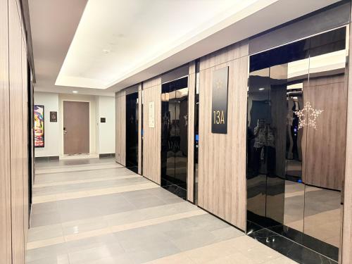 a hallway of a store with glass doors at Star Residence KL in Kuala Lumpur