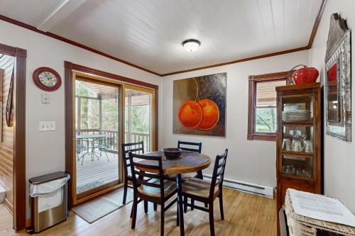 a dining room with a table and chairs at Andreas Creek Cabin #1 in Boone