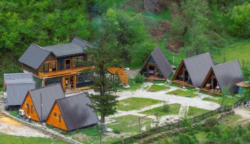 an aerial view of a house with a train yard at Thethi Villas in Theth