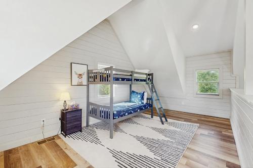 a bedroom with a bunk bed in a attic at Your Lake Haven in Dandridge