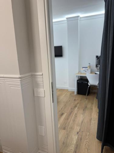 an open door to a room with a desk at Emy Suites in Civitavecchia