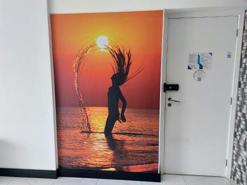 a woman standing in the ocean with her hair at Book Santos — Unlimited 1412 — Estúdio completo… in Santos