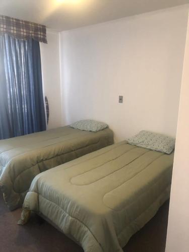 Postel nebo postele na pokoji v ubytování Anexo Hotel Quitor
