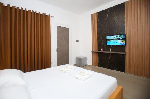 Postel nebo postele na pokoji v ubytování Aqua Blue Hotel
