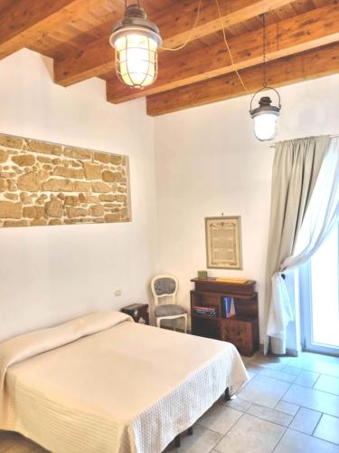 Posteľ alebo postele v izbe v ubytovaní B & B Stella Marina