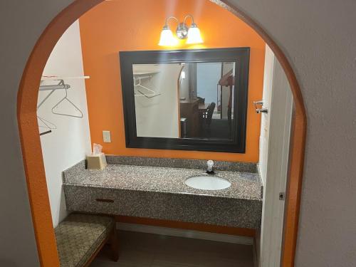 a bathroom with a sink and a mirror at 2 Double Beds Hotel Studio 234 in Livingston