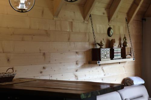 a room with a wooden wall with a table at Portes du Soleil - Zabljak in Žabljak