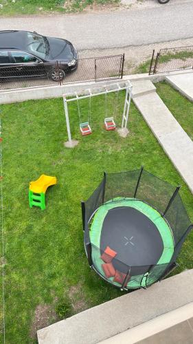 an aerial view of a playground with a swing at SNAM Rooms&Apartment in Žabljak