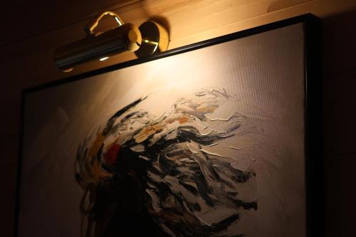 a picture of a painting on a wall with a light at Portes du Soleil - Zabljak in Žabljak