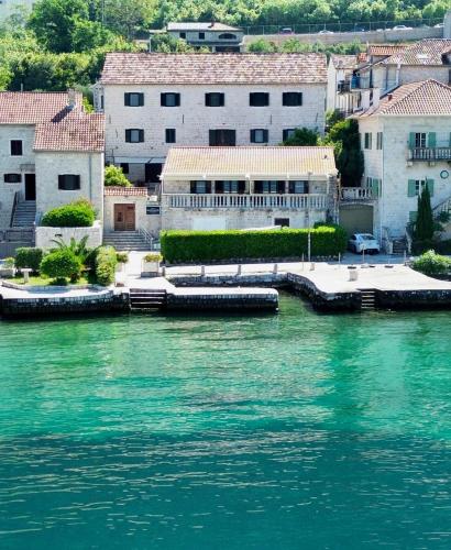 a view of a body of water with buildings at Apartments Radonicic in Kotor