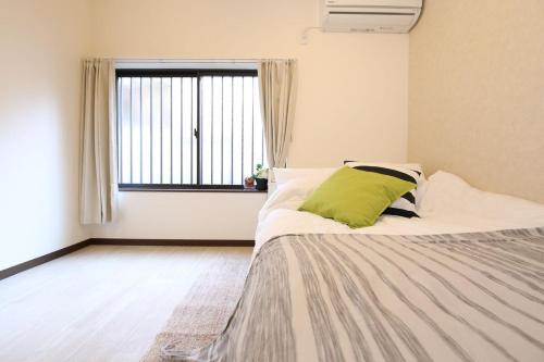 Postel nebo postele na pokoji v ubytování 大阪城公園 6分鐘森之宮站 2層日式小屋 2臥室 獨立衛浴