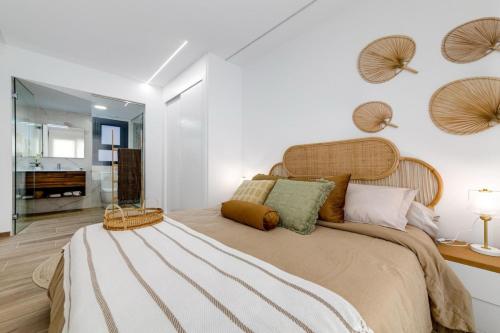 a bedroom with a large bed and a bathroom at Apartment Valentino Golf 3 in Villamartin