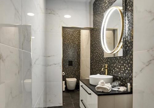 a bathroom with a sink and a mirror at Breaffy House Hotel and Spa in Castlebar
