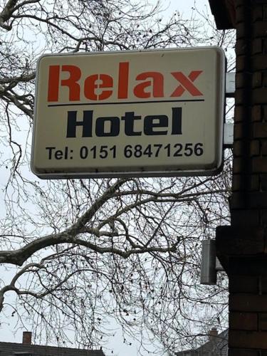 a sign for a relax hotel on the side of a building at Relax Hotel-Ludwigshafen in Ludwigshafen am Rhein