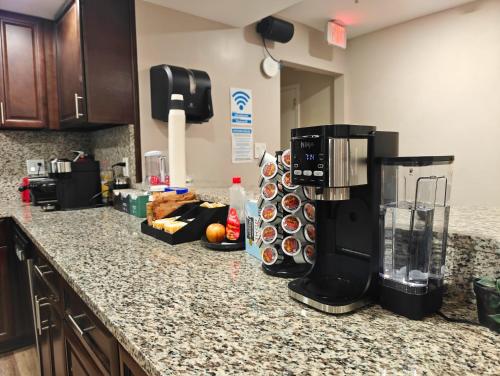 a kitchen counter with a coffee maker on it at I Street Capsule Hostel in Washington