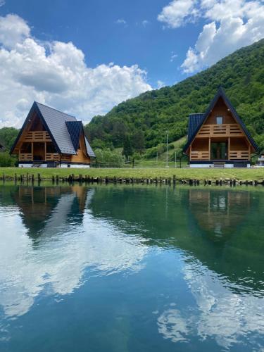 a house next to a body of water at Bungalow Jajce 2 in Jezero