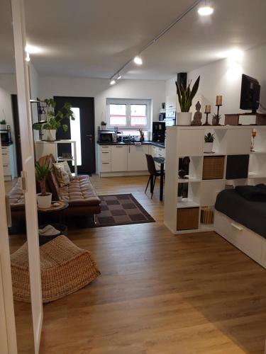 a living room with a couch and a table at Ferienwohnung Toni in Memmingen