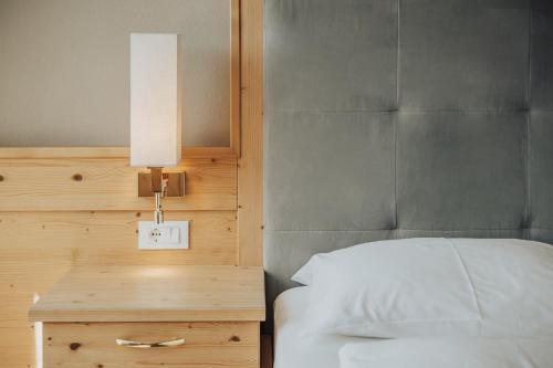 Postel nebo postele na pokoji v ubytování Hotel Lisetta