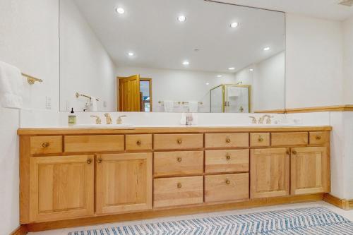 a bathroom with a sink and a large mirror at Arrowhead Escape in Edwards