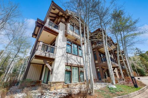 an apartment building with trees in front of it at Arrowhead Escape in Edwards