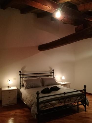 Ένα ή περισσότερα κρεβάτια σε δωμάτιο στο Via Pepoli Apartments