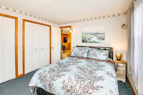 a bedroom with a large bed and a window at Bay Views Peaceful Acadia National Park Getaway! in Steuben