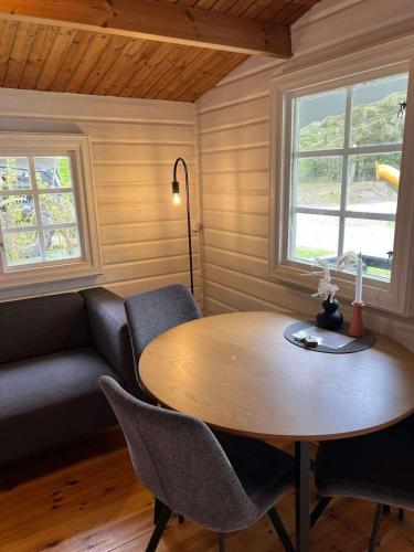 a living room with a table and a couch at Blockhütte in Fanø