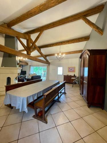 a large kitchen with a bed in a room at Authentique Mas provençal entre mer et Camargue in Marsillargues