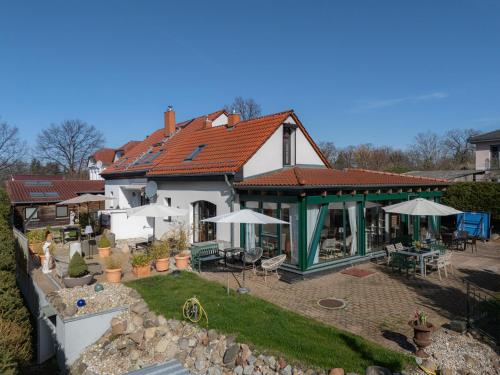 an aerial view of a house with a patio at Ferienhof am Trift in Bad Saarow