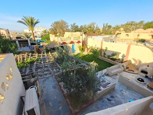 a view of a garden from the roof of a house at Motel moon in Tunis