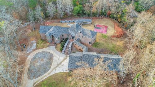 an aerial view of a house with a train at The Panola Mansion - Indoor Pool & Pavilion in Stockbridge