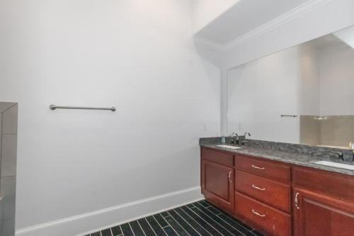 a bathroom with a sink and a mirror at The Panola Mansion - Indoor Pool & Pavilion in Stockbridge