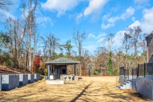 a basketball court with a gazebo in a park at The Panola Mansion - Indoor Pool & Pavilion in Stockbridge