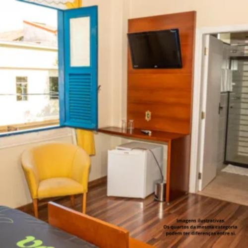 TV a/nebo společenská místnost v ubytování VOA Hotel Caxambu