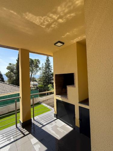 a view of a house from the balcony of a house at La casa amarilla in El Barraco