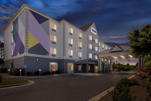 a rendering of a hotel at night at Spark by Hilton Homewood Birmingham in Birmingham
