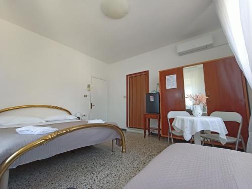 Ένα ή περισσότερα κρεβάτια σε δωμάτιο στο BeeLiving Room&Breakfast