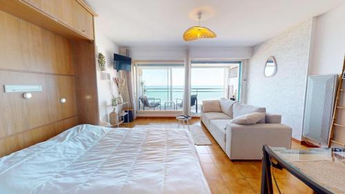 Ένα ή περισσότερα κρεβάτια σε δωμάτιο στο Le Belvedere de l Atlantide